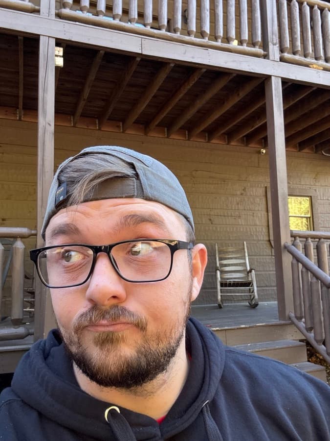 Floki in a backwards cap on the cabin porch
